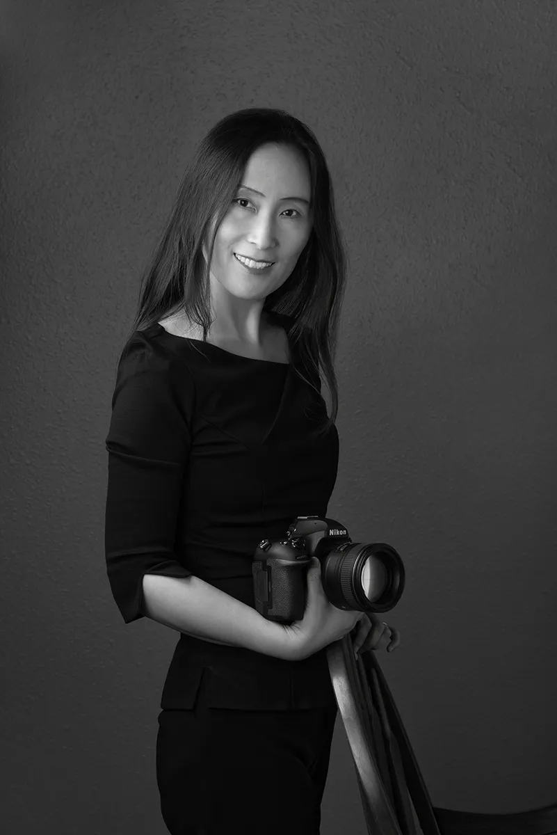 Jiang with camera in her portrait studio Colorado
